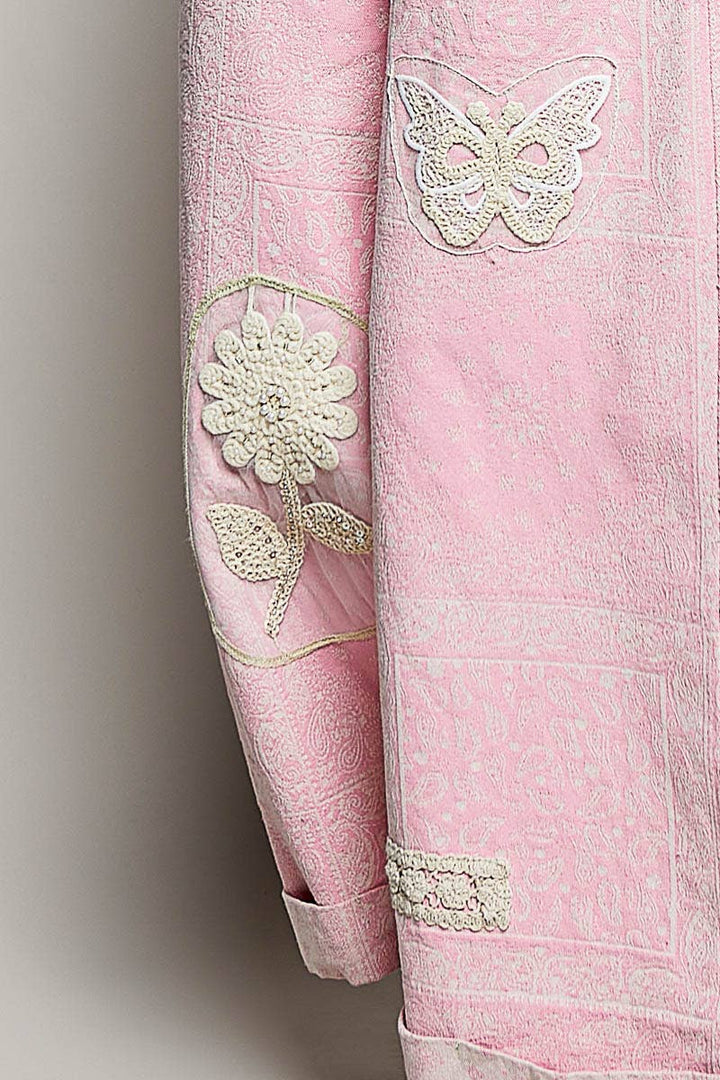 Close-up of pink paisley floral crochet pearl patch overalls — Heritage 1823 boutique.