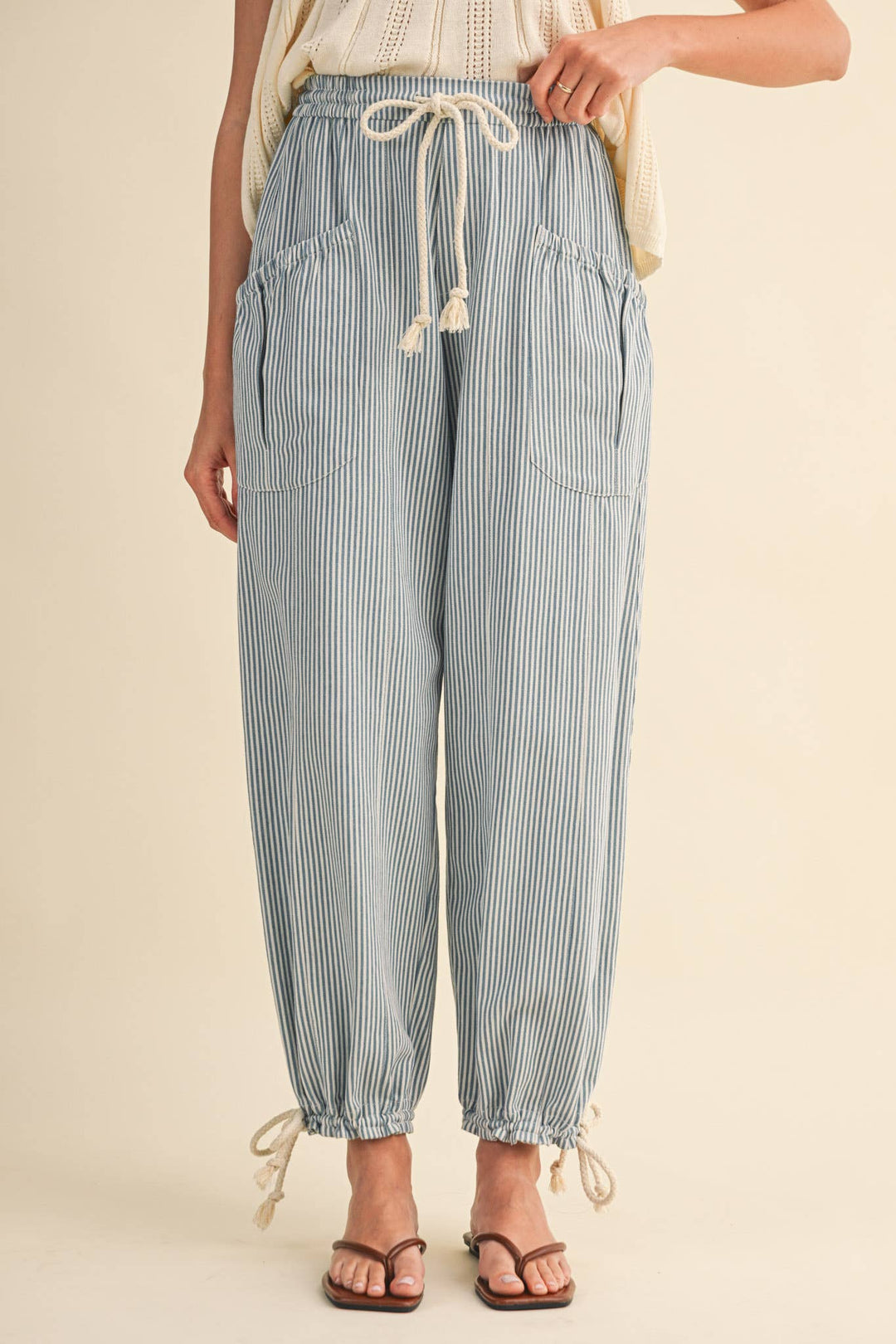 Back view of denim stripe parachute pants — Heritage 1823 boutique.