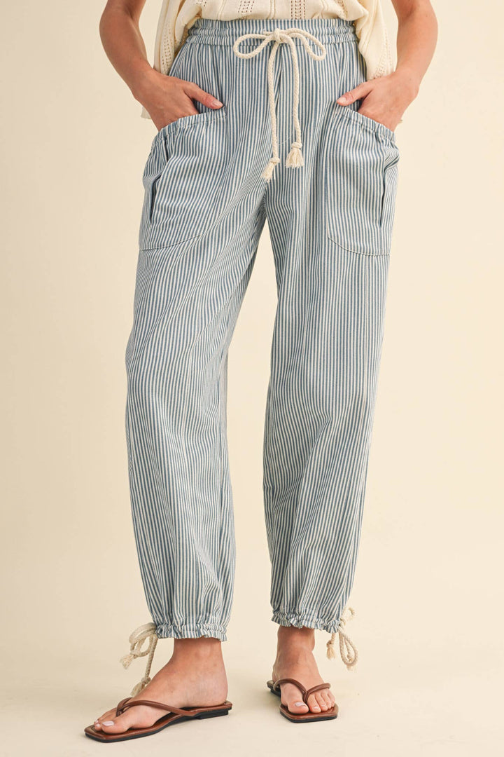 Side view of denim stripe parachute pants — Heritage 1823 boutique.