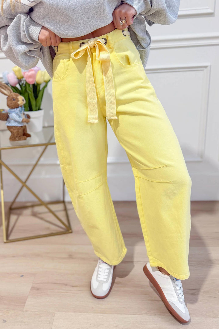 Front view of yellow washed eyelet barrel pants — Heritage 1823 boutique in Dublin, TX.